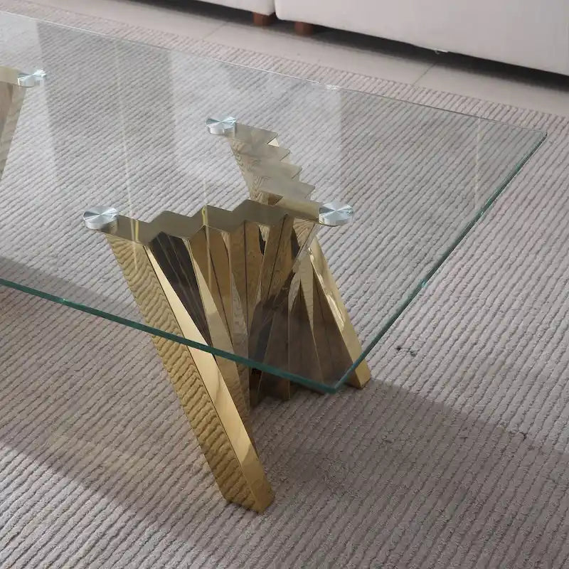 Table basse avec plateau en verre trempé et base en acier inoxydable finition miroir