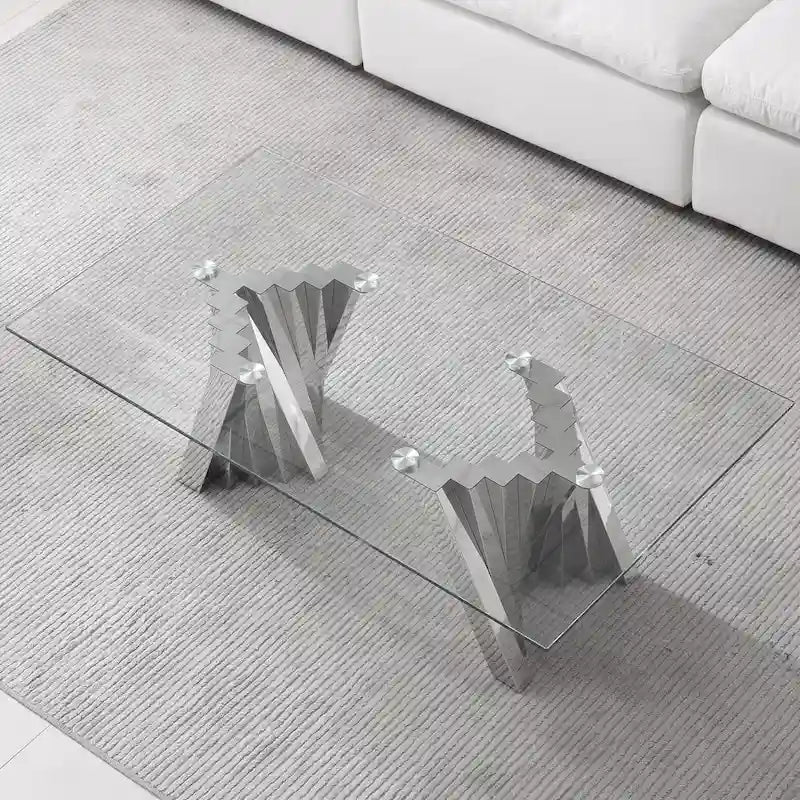 Table basse avec plateau en verre trempé et base en acier inoxydable finition miroir