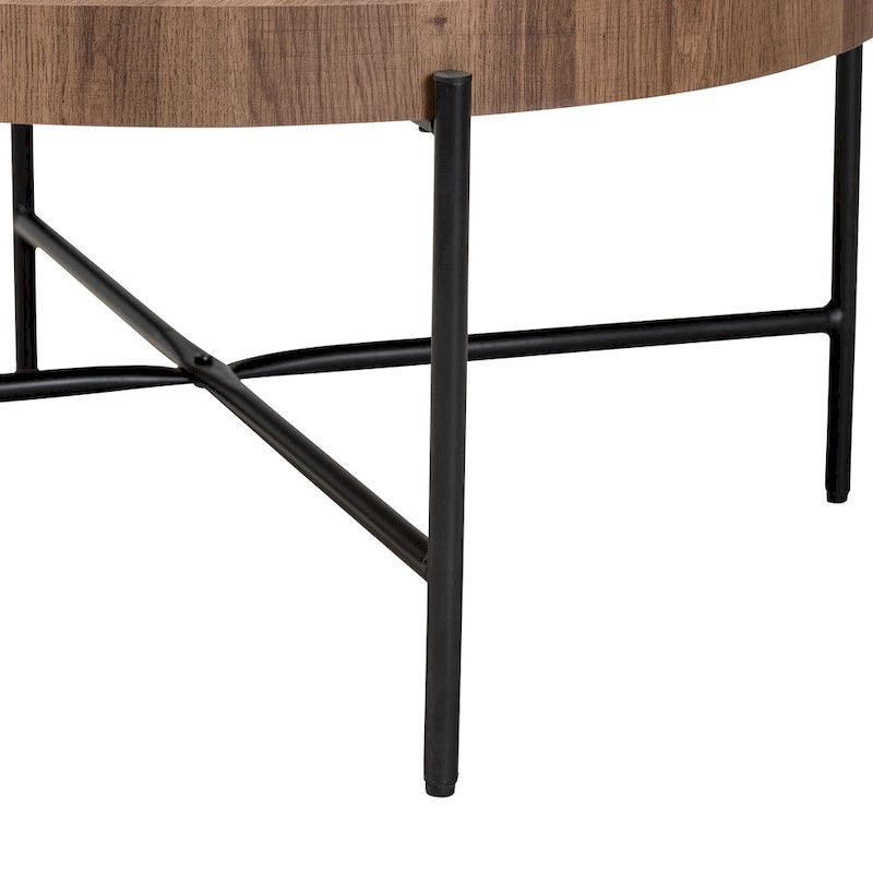 Table basse industrielle ronde avec plateau en bois de noyer et piétement en métal noir entrecroisé